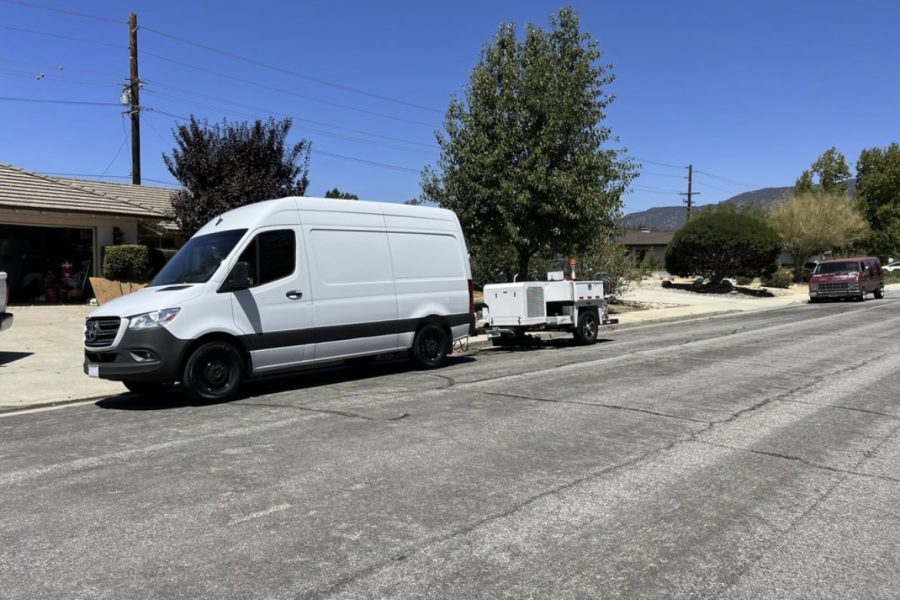 Plumbing van pulling a hydro jet machine